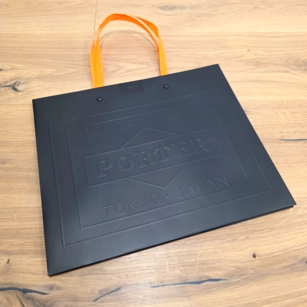 Porter Yoshida Black and Orange Paper Bag